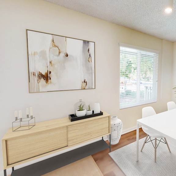 a white dining table with four chairs and a cabinet with a plant on top at pleasanton glen apartments, pleasanton, california
