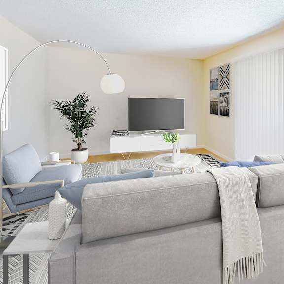 a modern living room with a grey sofa and a television at pleasanton glen apartments, pleasanton, california