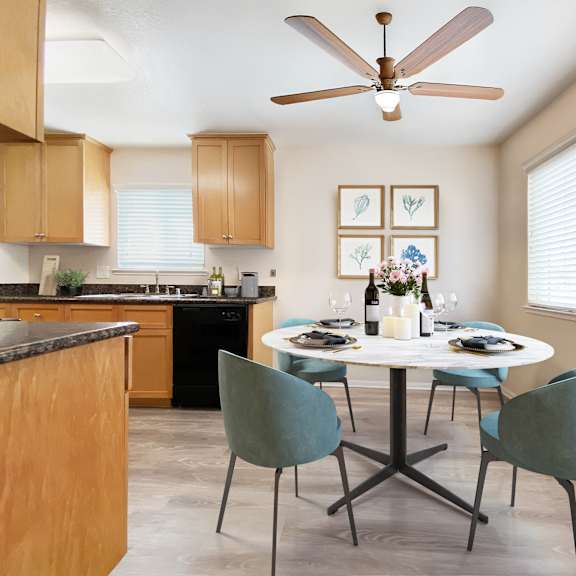 a kitchen with a table set for two and a ceiling fan at pleasanton place, pleasanton, ca, 94566