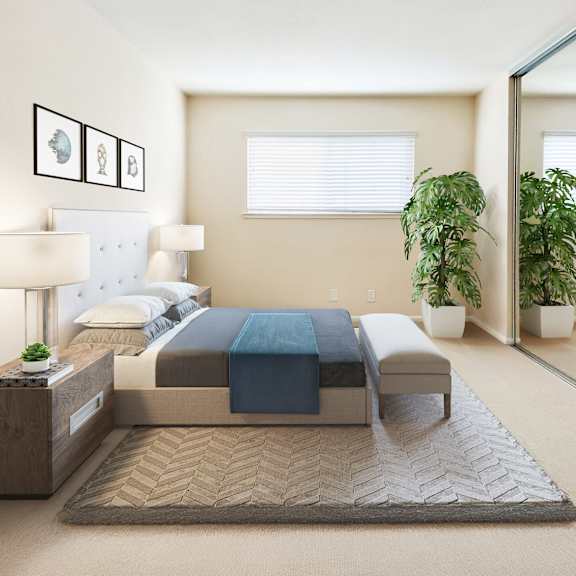 a bedroom with a bed, nightstand, and potted plants at pleasanton place, pleasanton, ca, 94566