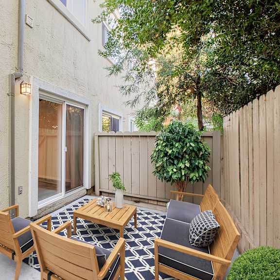 a patio with a table and chairs at pleasanton place, pleasanton, ca, 94566