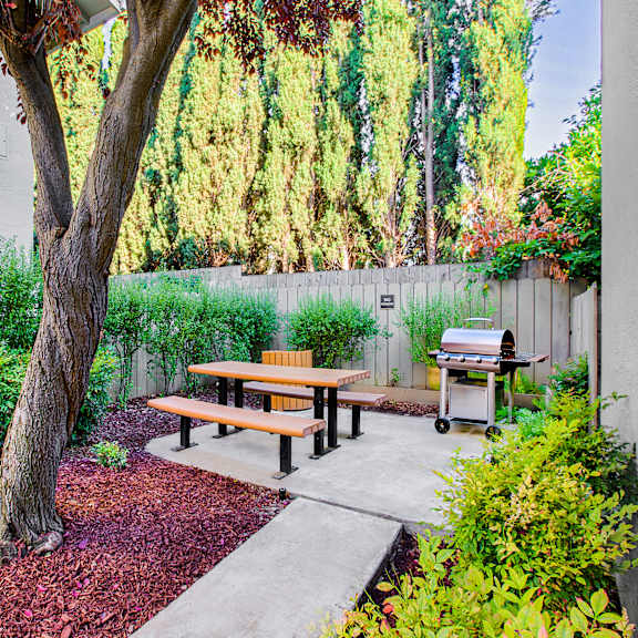 a backyard with a picnic table and a tree at pleasanton place, pleasanton, ca, 94566