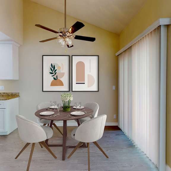 a dining room with a table set for two and a ceiling fan at valley plaza villages, california, 94566