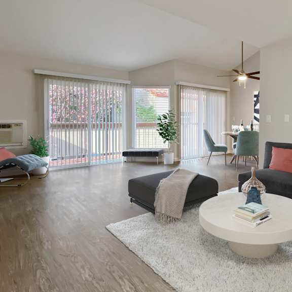 a living room with a black couch, a white coffee table, and a ceiling fan at valley plaza villages, california, 94566