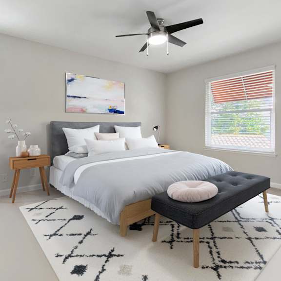 a bedroom with a large bed, a ceiling fan, and a rug on the floor at valley plaza villages, california, 94566