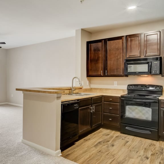 Thumbnail 3 of 5 kitchen and living room at Las Brisas Apartment Homes, Round Rock