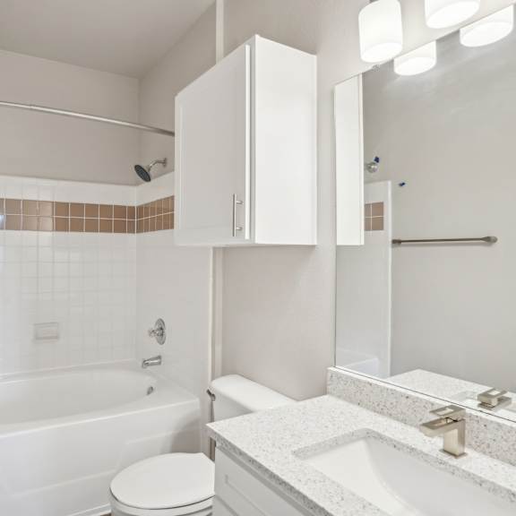 Thumbnail 6 of 6 a white bathroom with a tub and a sink and a toilet at The Verandah, Austin, Texas