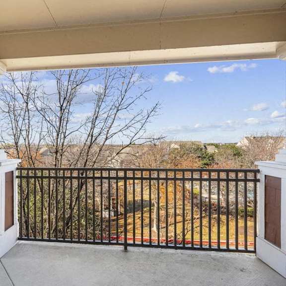 Thumbnail 10 of 10 the view from the front porch of a home with a balcony at The Legends at Eagle Mountain Lake, Fort Worth