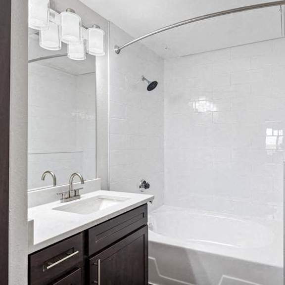Thumbnail 7 of 10 a white bathroom with a sink and a bath tub at The Legends at Eagle Mountain Lake, Fort Worth, TX, 76179