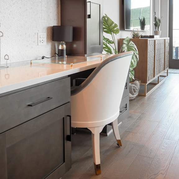 3-bedroom model built-in workspace with chair and lamp at the hamilton apartments in dallas, tx