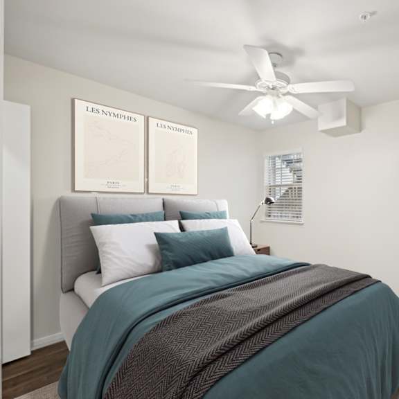 a bedroom with a bed and a ceiling fan at woodlands of plano