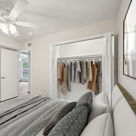 a bedroom with a bed and a closet at woodlands of plano in plano, tx