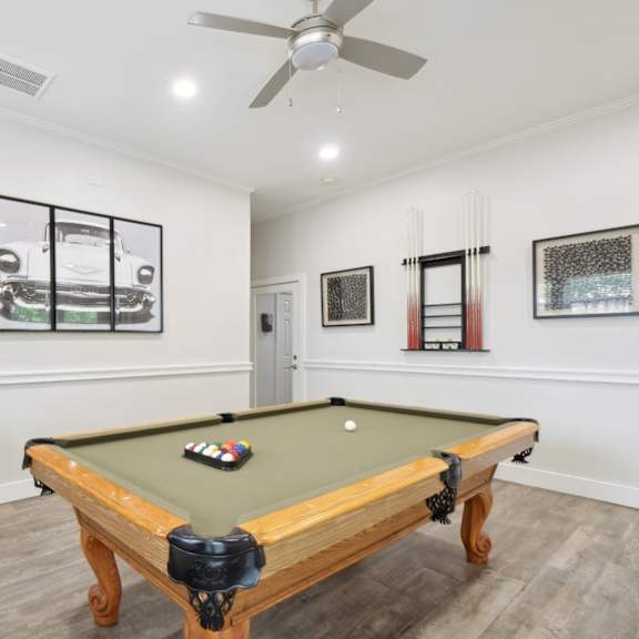 a pool table in the resident lounge at jefferson place apartments in irving, tx