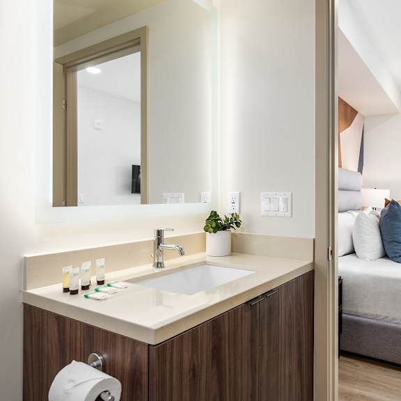 modern vanity area with bedroom access at lido - 1532 brockton ave apartments, los angeles, california