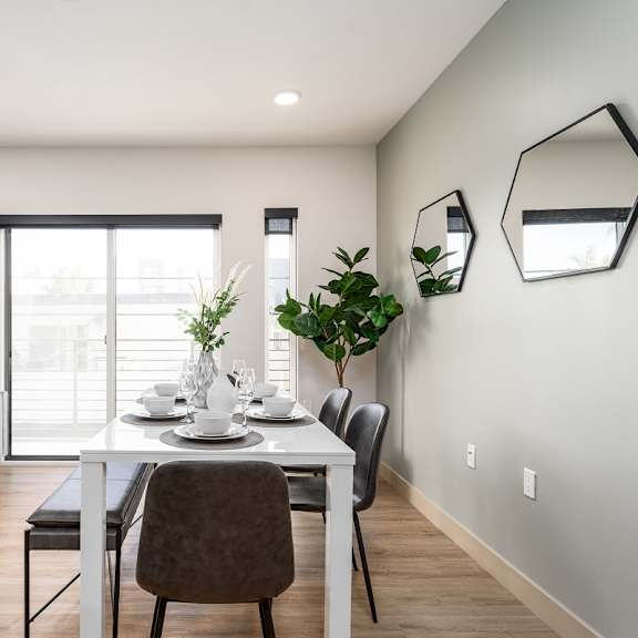 modern dining room with geometric mirrors at lido - 1532 brockton ave apartments, los angeles, california