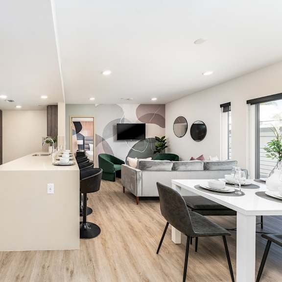 open concept apartment with kitchen island and dining area at lido - 1532 brockton ave apartments, california