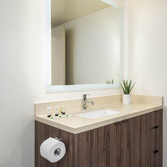 modern powder room with floating vanity at lido - 1532 brockton ave apartments, california, 90025