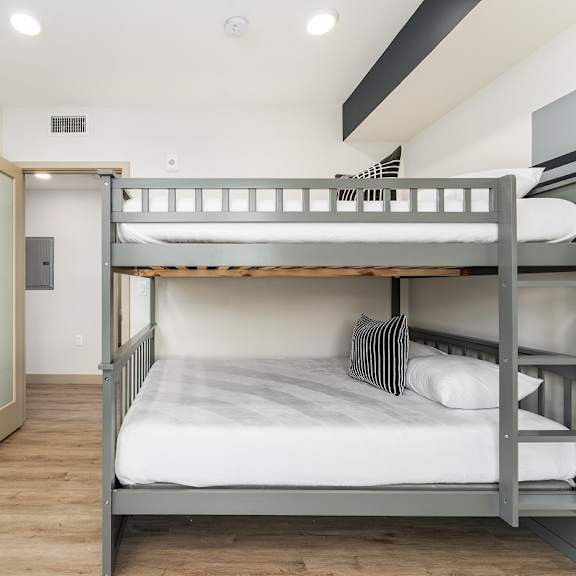 shared bedroom with gray bunk beds at lido - 1532 brockton ave apartments, los angeles, ca