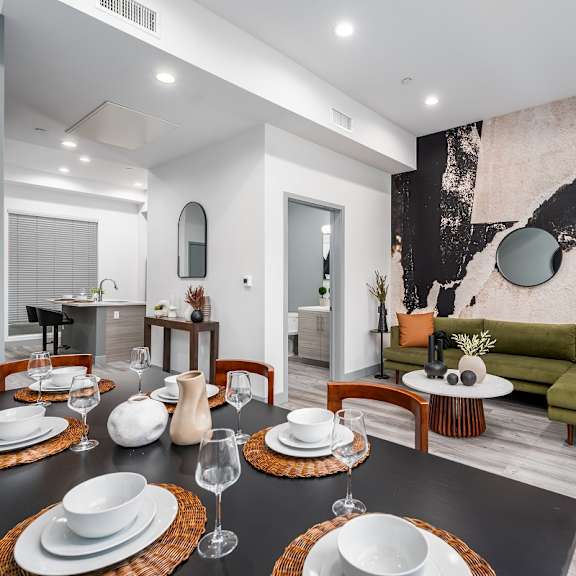 a dining room with a table and chairs and a living room at lido apartments - 4025 grandview, culver city, ca, 90066