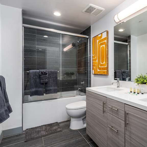 a bathroom with a toilet sink and shower at lido apartments - 4025 grandview, culver city, california