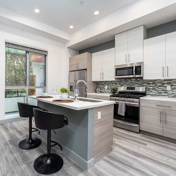 a kitchen with a counter top and a sink at lido apartments - 4025 grandview, culver city, ca