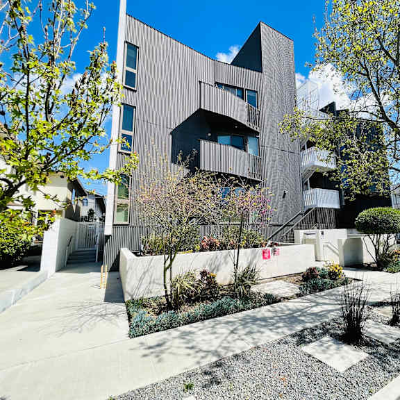 contemporary building exterior with front landscaping at lido - 3714 kelton apartments, los angeles, 90034