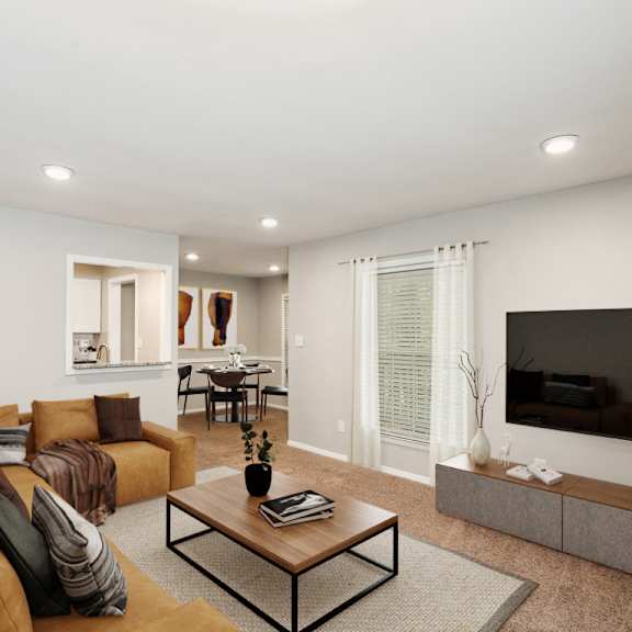 a living room with a couch and a coffee table in front of a flat screen tv  at lake johnson mews, raleigh, nc, 27606