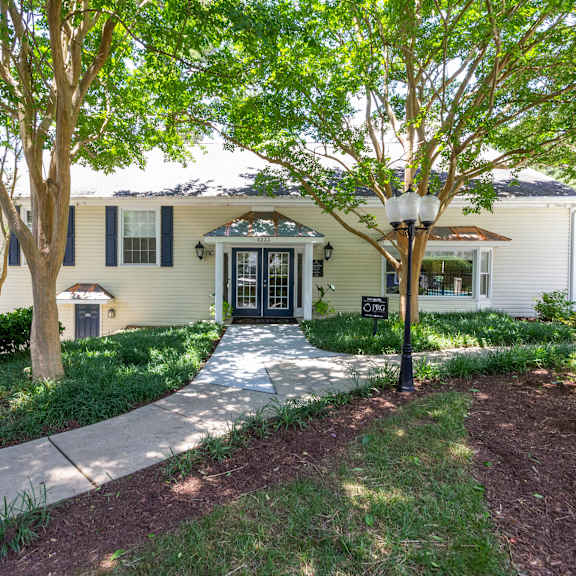 exterior-courtyard at lake johnson mews apartments, prg real estate management, north carolina, 27606