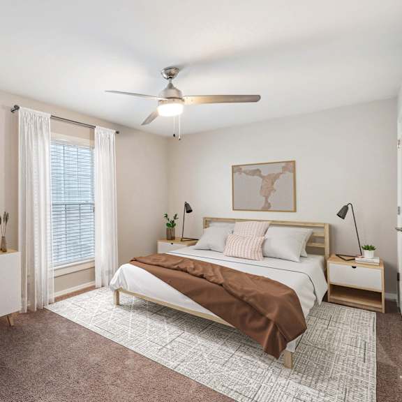 a bedroom with a bed and a ceiling fan at lake johnson mews, north carolina, 27606