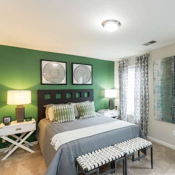 bedroom with green wall at the resort at lake crossing apartments, prg real estate, lexington, ky