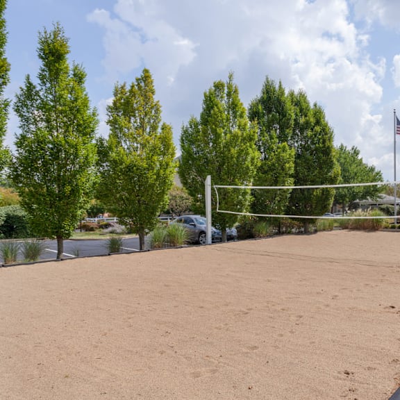sand volleyball court at chinoe creek apartments, lexington