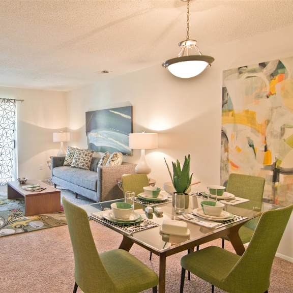 living room with dining area at lakecrest apartments, prg real estate management, greenville, south carolina