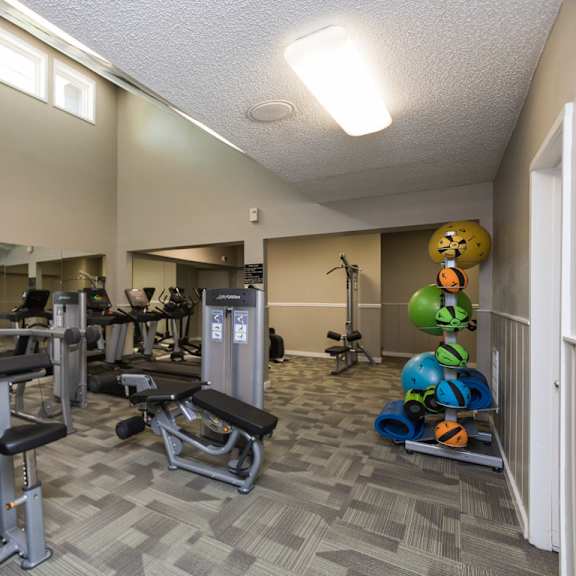two state-of-the-art fitness facility with yoga and strength training at lakecrest apartments, prg real estate management, south carolina, 29615