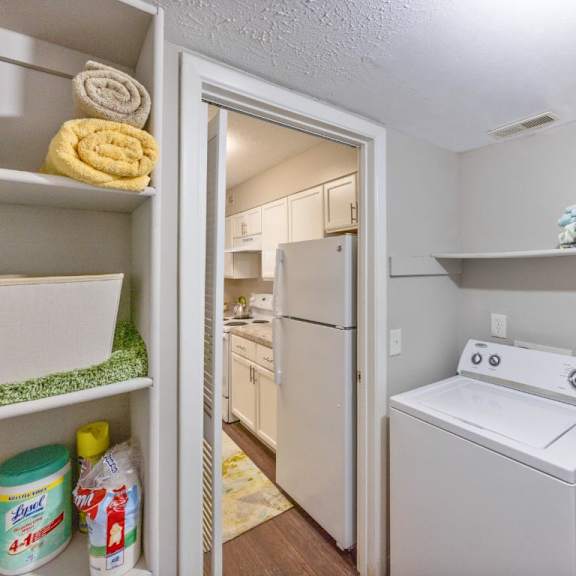 a laundry room with a white washer and dryer at chinoe creek apartments, lexington, ky, 40502