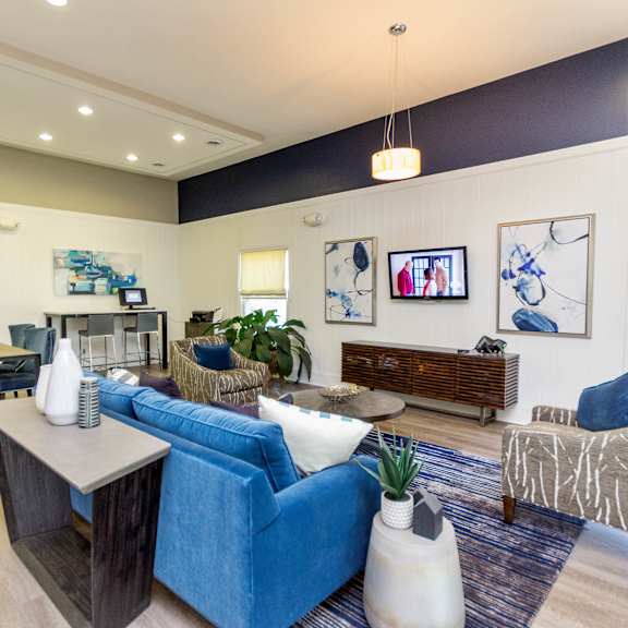 resident lounge with media at lake johnson mews apartments, prg real estate management, north carolina, 27606