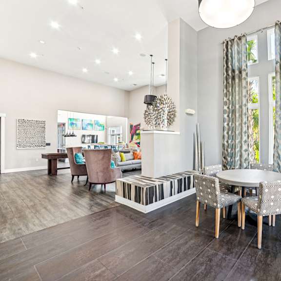 a modern dining room with a glass table and chairs at proximity apartments, south carolina, 29414
