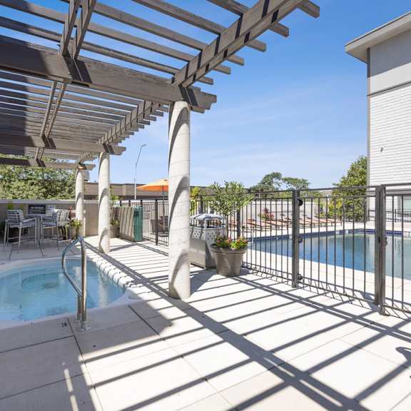 view of the pool and hot tub at 45 madison apartments, missouri, 64111