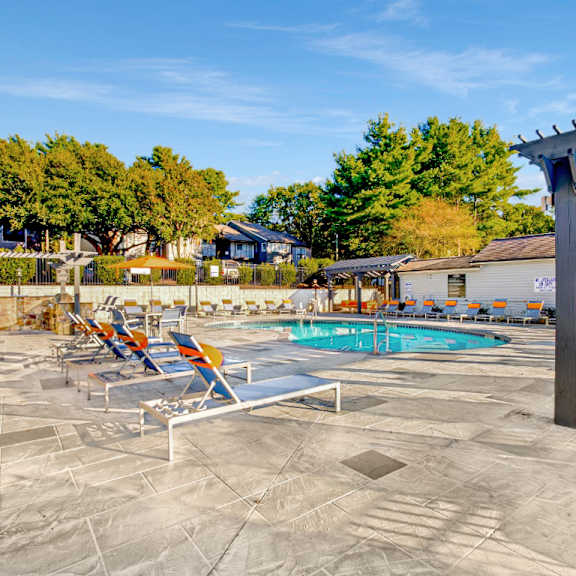 poolside sundeck with relaxing chairs at edgemont  apartments, prg real estate, greenville, sc