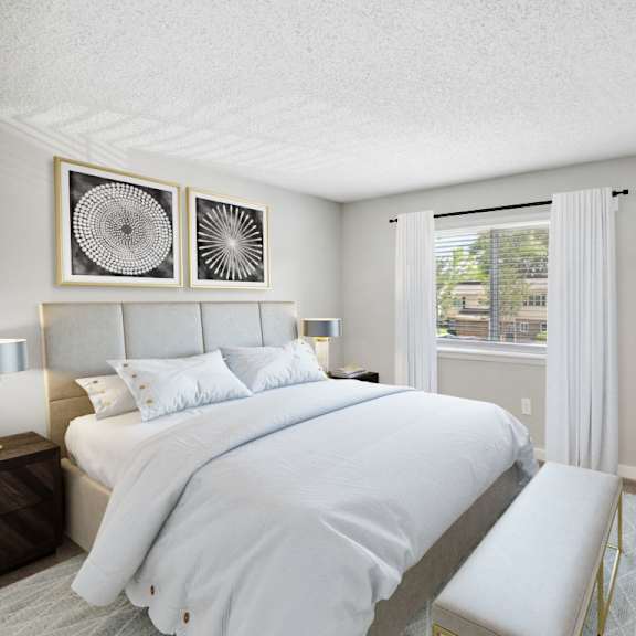 bedroom with large bed at lakecrest apartments, prg real estate management, greenville, sc
