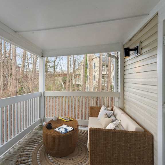 a porch with a couch and a table on it at ashton creek, chester, 23831