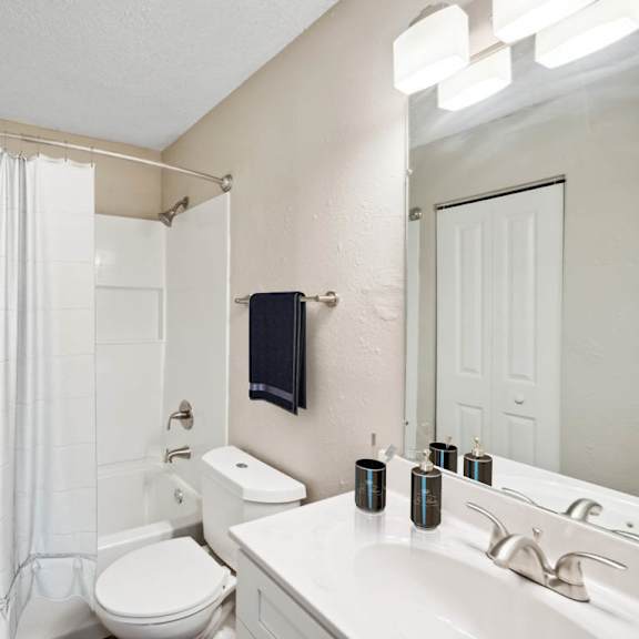 bathroom with shower at lakecrest apartments, prg real estate management, greenville, sc