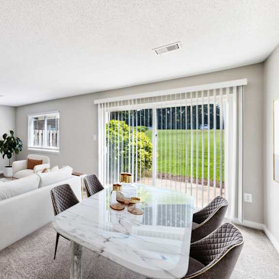 living room with large windows at lakecrest apartments, prg real estate management, greenville, sc