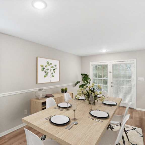 a dining room with a wooden table and chairs at lake johnson mews, raleigh, 27606