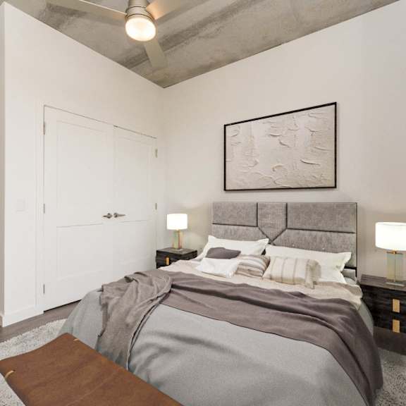 bedroom with large bed and closet at south falls tower, richmond, va
