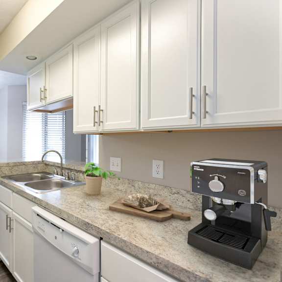 stainless steel sink with faucet in kitchen at chinoe creek apartments, lexington, ky