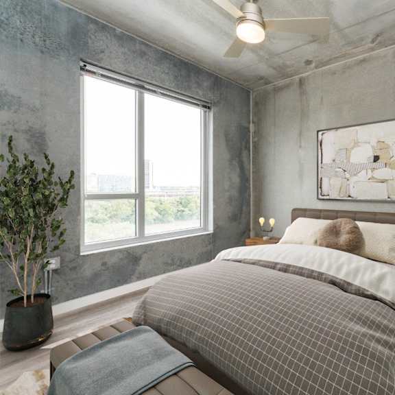 bedroom with bed and large window at south falls tower, richmond, va