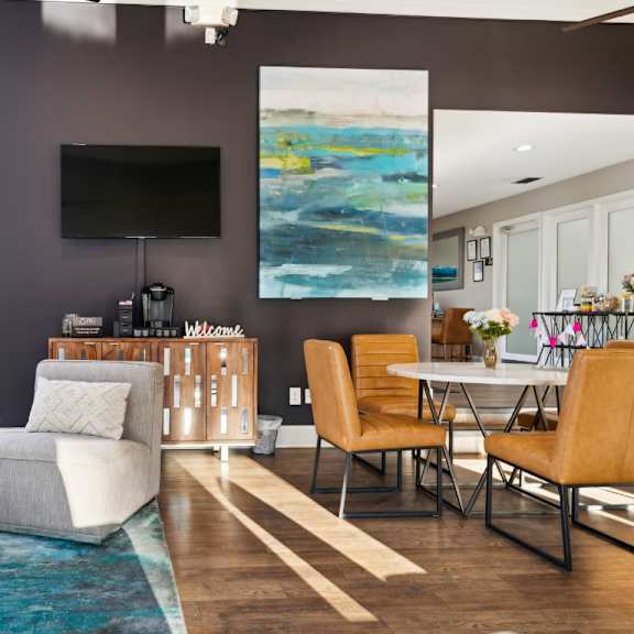 a living room with a couch and chairs and a table and a television at ashton creek, chester, va