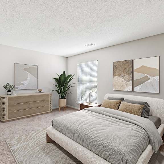 a bedroom with a large bed and a wooden dresser at park ridge estates, durham, 27713