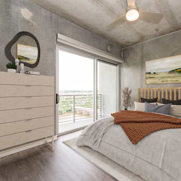 bedroom with bed and large windows on the side at south falls tower, richmond, va