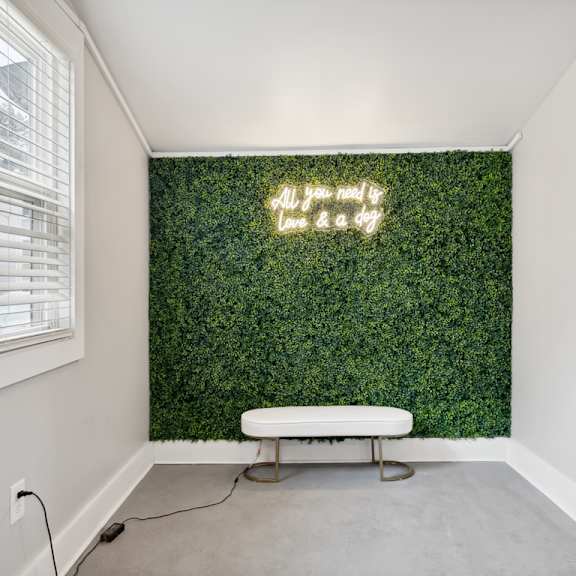 a living wall with a white bench in front of it at linkhorn bay apartments, virginia, 23451